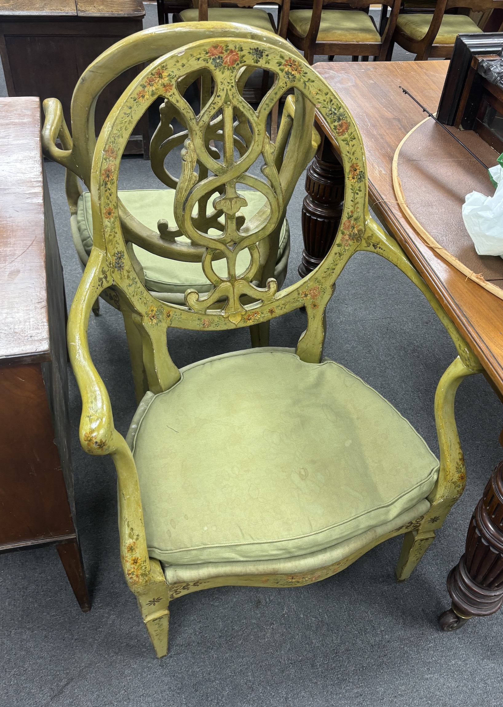 A set of four late 18th century Continental green painted elbow chairs, width 62cm, depth 50cm, height 100cm